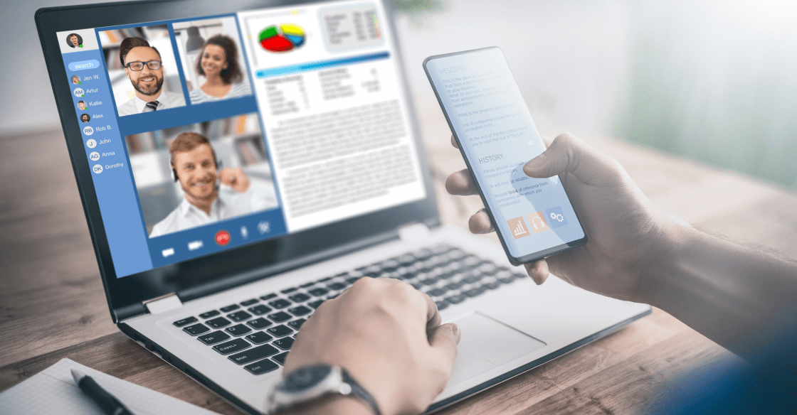 A man works from home while video chatting with coworkers and accessing secure workplace documents.