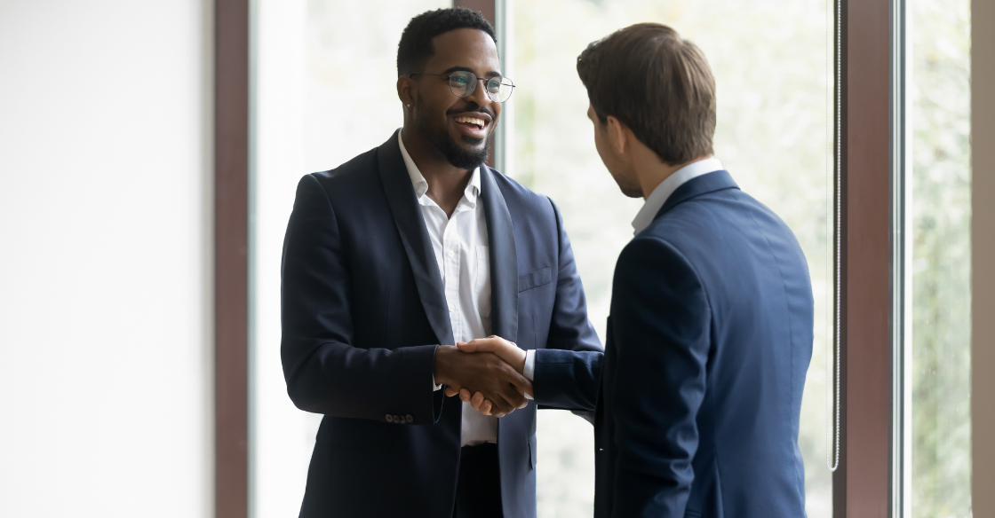 Businessmen shake hands over a deal 